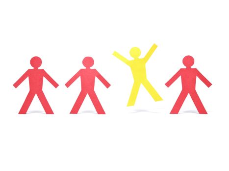 A yellow paper figure is celebrating between other red paper figures.