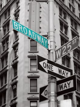 green broadway sign in a black and white abstract photo