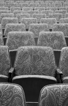 empty wooden cinema/theater seats, black and white photo