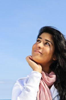 Portrait of beautiful smiling girl looking up