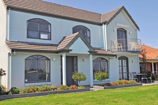 Australian family house, Exterior facade. White house, Green front yard