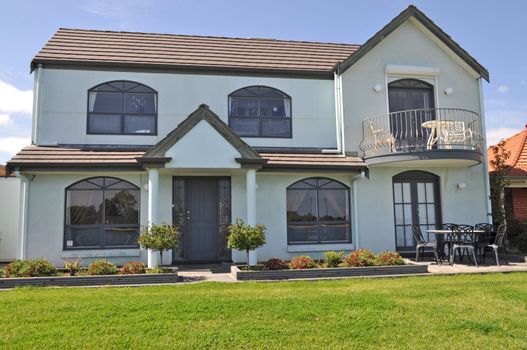 Australian family house, Exterior facade. White house, Green front yard