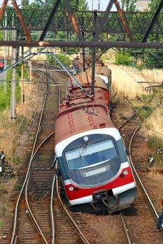 Derailed train standing off the tracks