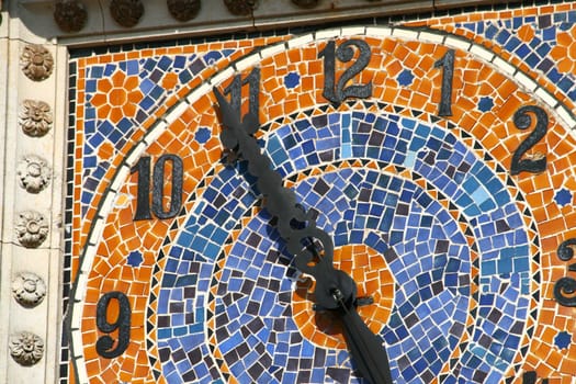 Old ceramical clock at the top of the tower
