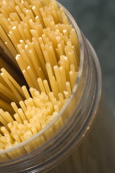 spaghetti in a plastic container, detail abstract photo