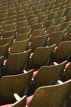 empty wooden cinema or theatre seats, vertical photo