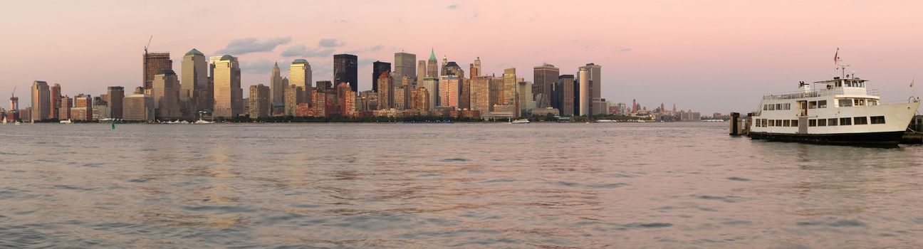 pink panorama photo of lower Manhattan, New York, USA, white ship in foreground