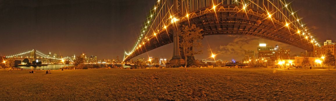 manhattan and brooklyn bridge night panorama photo, star light effect created with photo filter