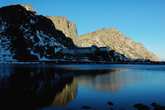 Landscape of mountains at lakeside in winter