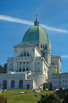 St.Joseph Oratory in Montreal, Canada; jet cloud in background