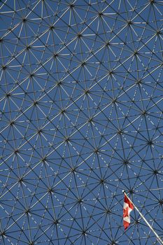 The Biosphere in Montreal detail abstact photo, small canadian flag 