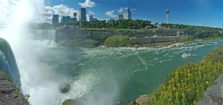 niagara falls, horseshoe waterfall left, photo taken from united states, canada on the other side, skylon tower and casino visible