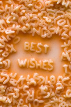 best wishes text made of alphabet pastries, ketchup