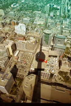 colored picture of toronto buildings with cn tower shadow,