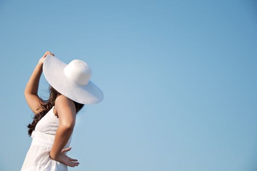 Freedom girl in the sky with white hat and dress