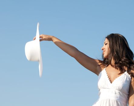 Freedom girl in the sky with white hat and dress