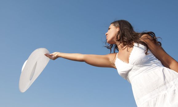 Freedom girl in the sky with white hat and dress