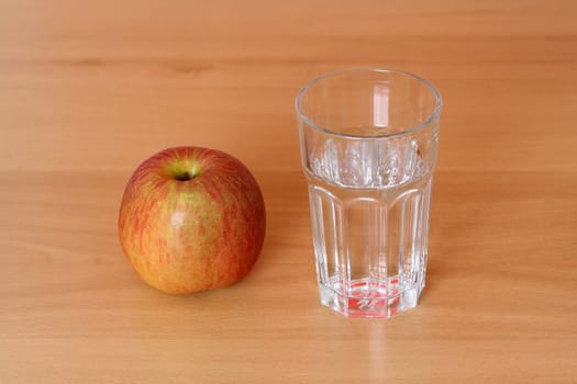 An apple and a glass of water