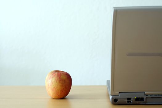 An apple and a laptop