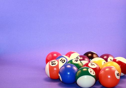 Pool balls on blue background.