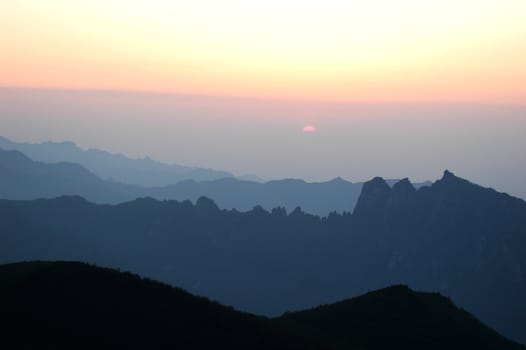 Landscape of mountains and skies at sunrise
