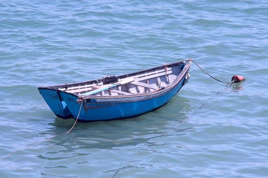 Fishing boat in the water off the pier