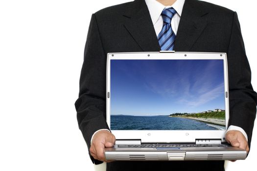 Businessman holding his laptop