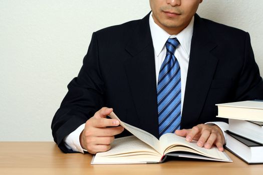 Businessman reading a book