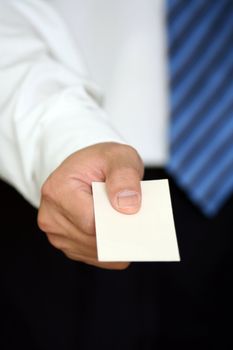 Businessman handing out a business card