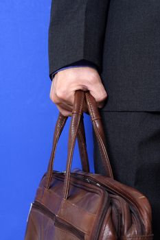 A businessman carrying a bag going to work