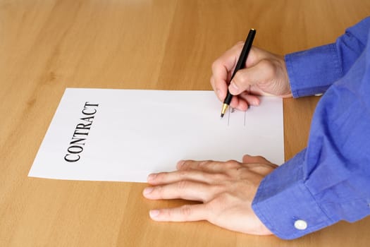 A businessman signing a contract or an agreement