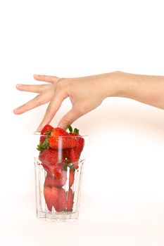 Picking a strawberry to eat