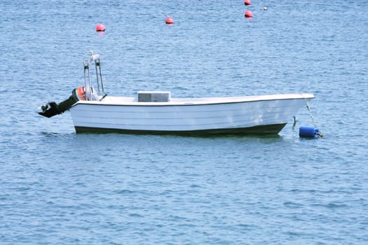 Fishing boat in the water off the pier