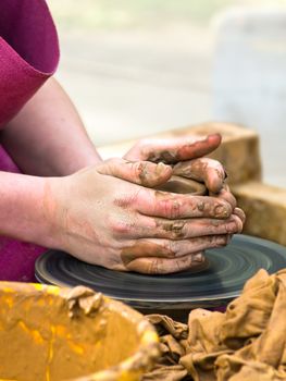 Photo of the potter worker hands at work