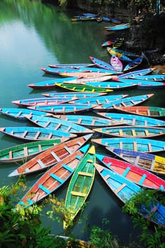 Scenery of colorful tour boats at a lake