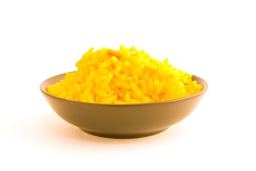Yellow cooked rice in a black bowl on a white background