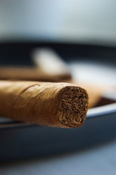 A cigar in ashtray, selective focus