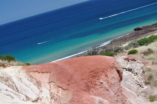 Beautiful azure, blue water beach with red stone. Hallett Cove Conservation Park, South Australia.