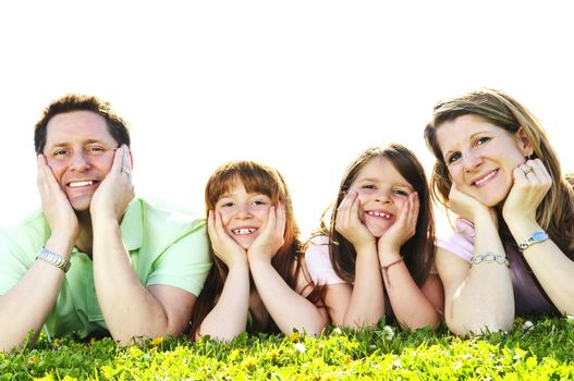 Portrait of happy family of four laying resting head on hands