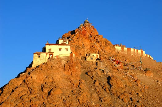 Landscape of small lamasery on the hills in Tibet