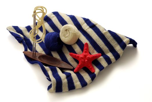 Marine theme in knitting  with blue and white clews, knitting needles and starfish