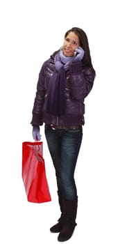 Young woman with shopping bags using a mobile phone.