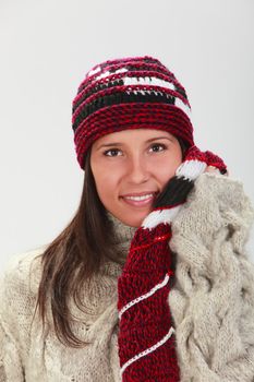 Portrait of a young woman wearing winter clothes.