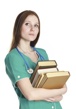 The portrait of kind female nurse in the green uniform with books, isolated on white background.