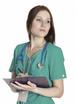 Female doctor wearing green uniform and holding a clipboard with medical paperwork.