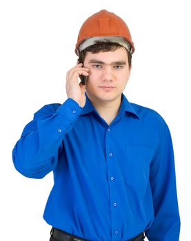 Builder in a helmet speaks on the phone