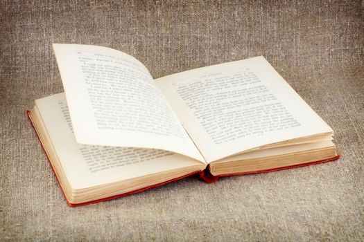 Open big old book on canvas background