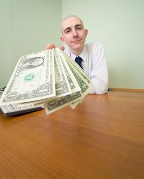 The chief stretching to us a pack of dollars