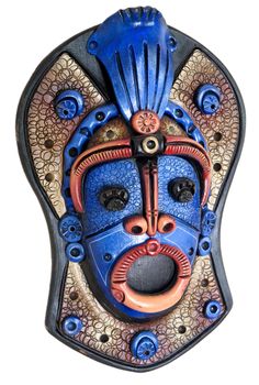 a colorful wooden mask from south america isolated on a white background