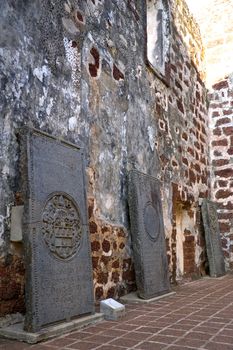 Ancient 17th century Dutch tombstones found at the ruins of St. Paul's Church, originally built by the Portuguese in 1521 at the UNESCO World Heritage site of Malacca, Malaysia.